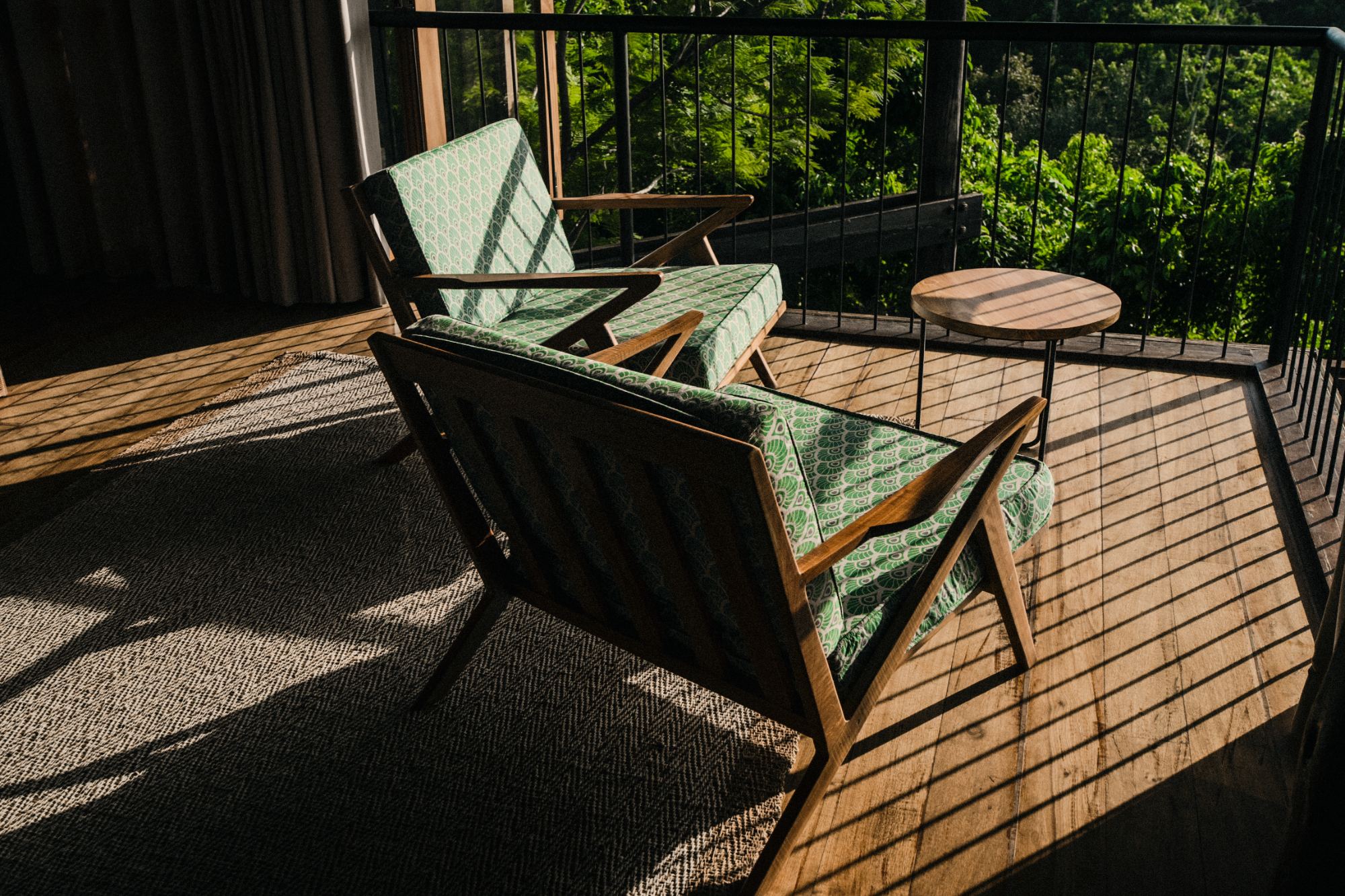 Golden-hour seating on a Round House balcony