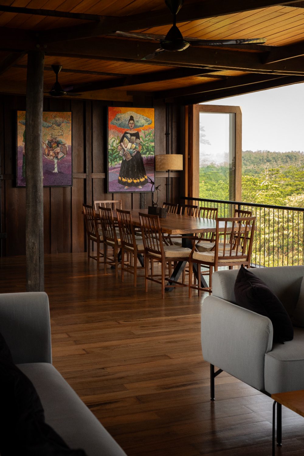 The communal dining table beneath the house&rsquo;s art collection